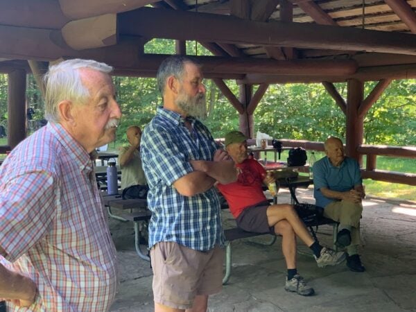 Reuben Rajala, Peter Jensen, Tom Ross, and Joe May looking on.